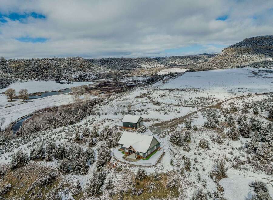 Nestled in a serene winter wonderland, this property offers a unique blend of natural beauty and modern comfort.