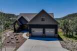 Discover this stunning modern home nestled in a picturesque mountain setting.