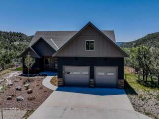 Discover this stunning modern home nestled in a picturesque mountain setting.