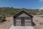 Discover this modern garage featuring two spacious bays, perfect for vehicle storage or a workshop.