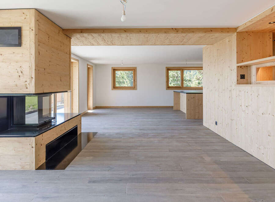 This stunning property boasts a modern interior with a focus on natural materials.