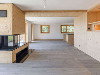 This stunning property boasts a modern interior with a focus on natural materials.