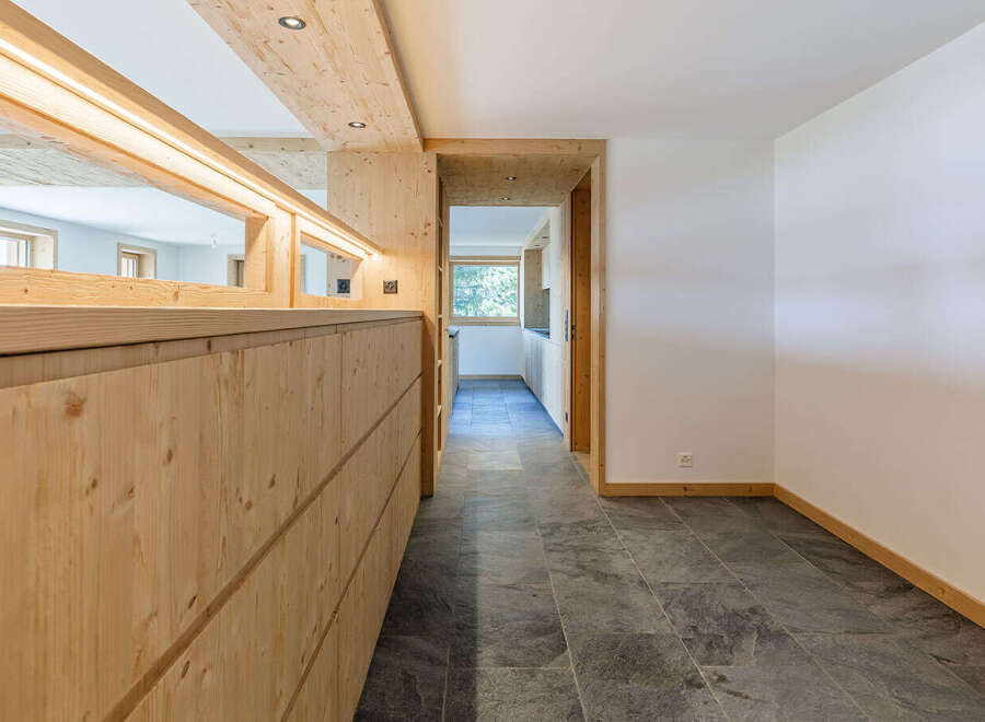 This stunning property showcases a modern interior with a focus on natural materials.