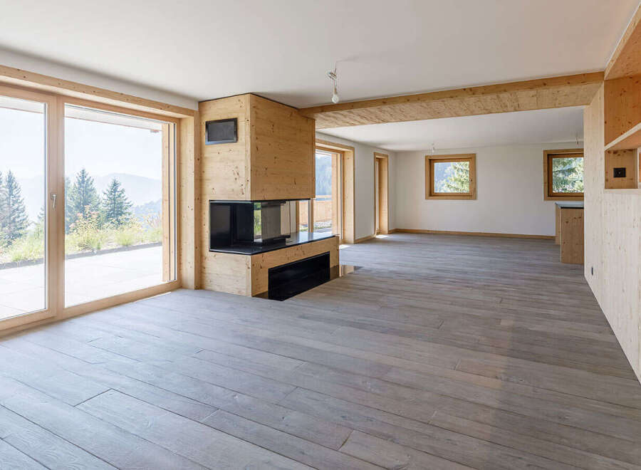 Experience the epitome of modern living in this stunning property, featuring expansive windows that frame breathtaking mountain views.