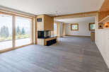 Experience the epitome of modern living in this stunning property, featuring expansive windows that frame breathtaking mountain views.