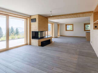 Experience the epitome of modern living in this stunning property, featuring expansive windows that frame breathtaking mountain views.