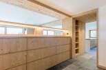This stunning property boasts a modern design with natural wood elements throughout.