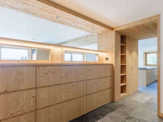 This stunning property boasts a modern design with natural wood elements throughout.
