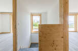 This stunning property showcases a modern interior with natural wood accents and a bright, airy atmosphere.
