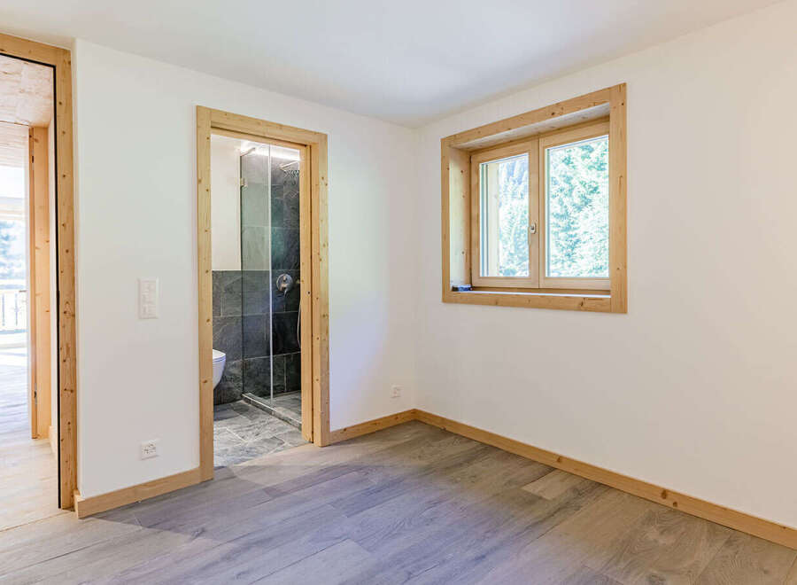 This inviting space features a bright and airy interior with a neutral color palette, creating a sense of calm and spaciousness.