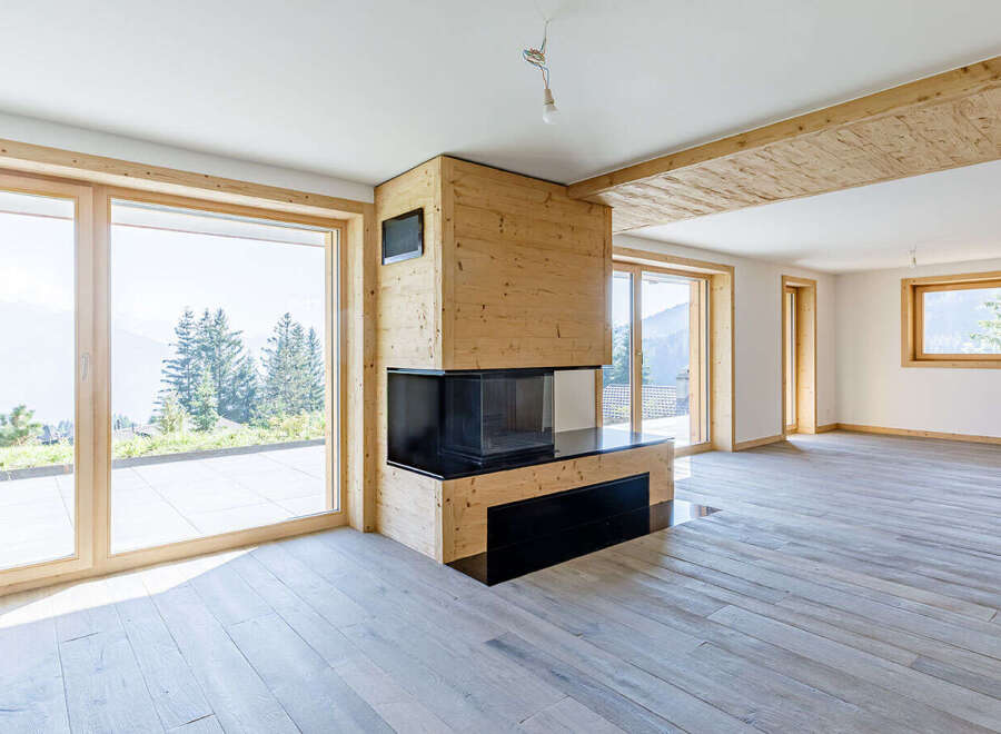 This stunning property boasts a modern design with a cozy fireplace, perfect for those chilly evenings.