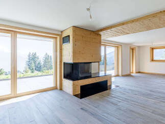 This stunning property boasts a modern design with a cozy fireplace, perfect for those chilly evenings.