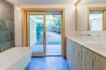 This modern bathroom features a sleek design with natural elements.