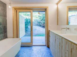 This modern bathroom features a sleek design with natural elements.