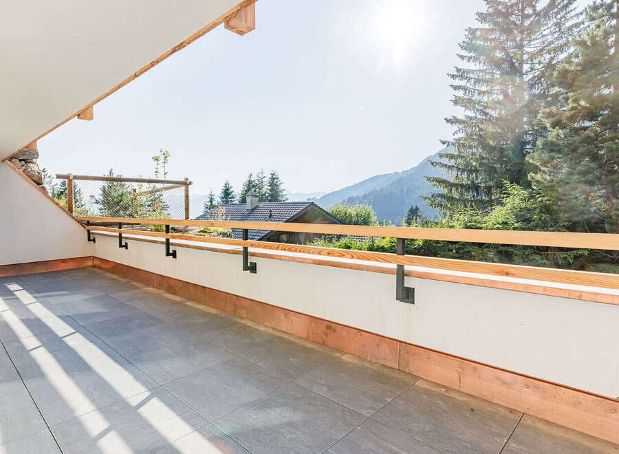 Enjoy breathtaking mountain views from this stunning balcony.
