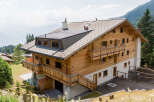 This stunning wooden chalet offers breathtaking mountain views and a serene escape.
