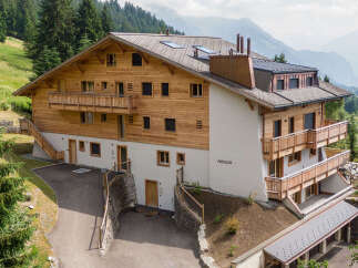 Nestled in a picturesque mountain setting, this stunning property offers a blend of rustic charm and modern elegance.