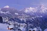 Nestled in a picturesque winter wonderland, this property offers stunning views of snow-capped mountains and a charming village.
