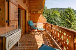Enjoy the tranquility of this charming balcony, perfect for relaxing and taking in the stunning mountain views.