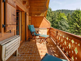 Enjoy the tranquility of this charming balcony, perfect for relaxing and taking in the stunning mountain views.