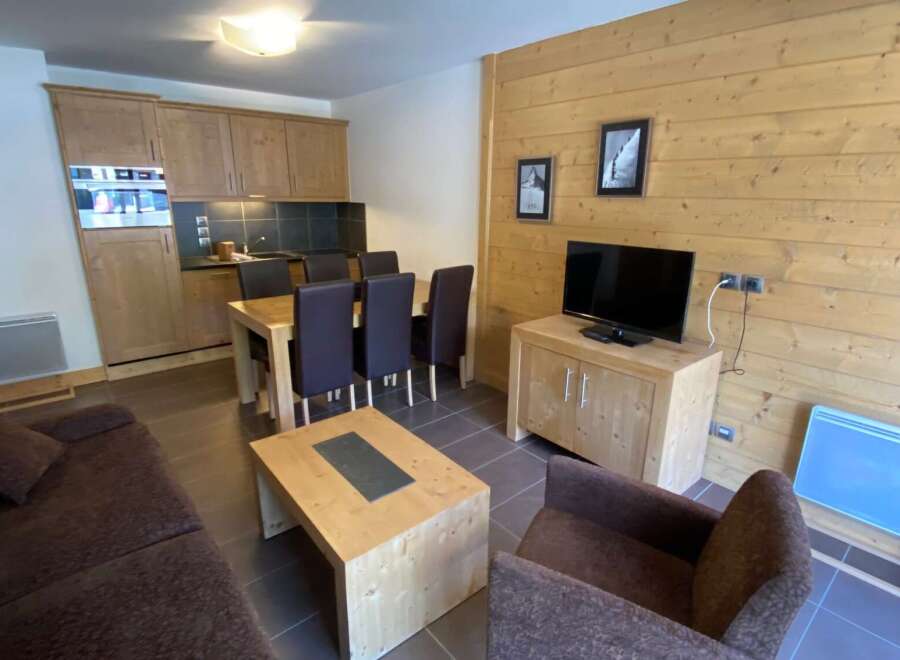 This cozy apartment features a well-equipped kitchen, perfect for preparing meals.