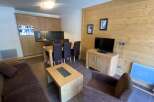 This cozy apartment features a well-equipped kitchen, perfect for preparing meals.