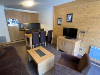 This cozy apartment features a well-equipped kitchen, perfect for preparing meals.