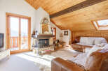 This charming property boasts a cozy living room with a rustic fireplace, perfect for those chilly evenings.