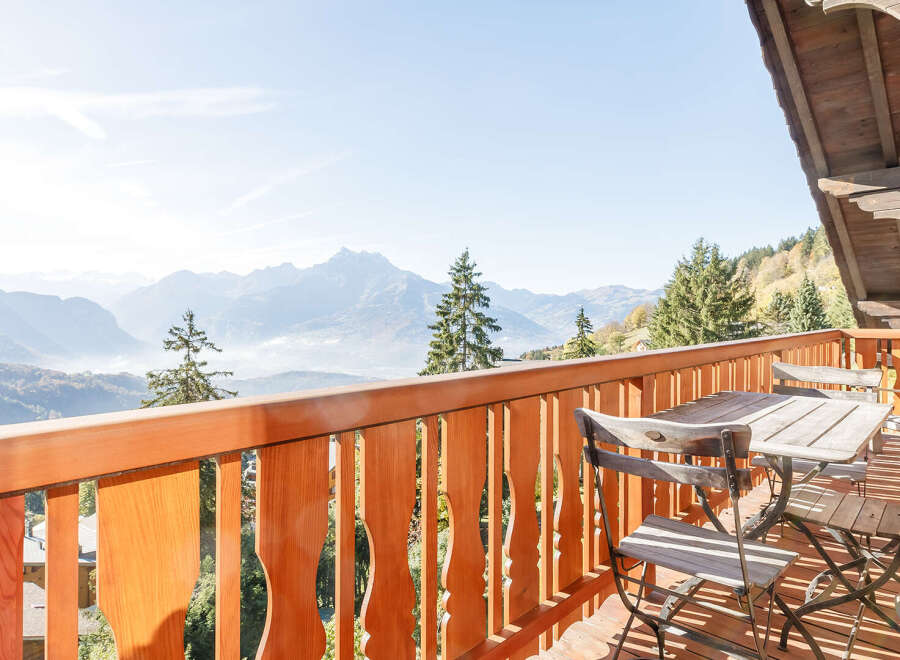Enjoy breathtaking mountain views from this charming balcony.