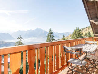 Enjoy breathtaking mountain views from this charming balcony.