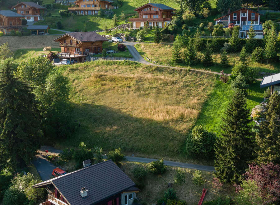 Nestled in a serene hillside, this property showcases stunning chalet-style homes.