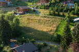 Nestled in a serene hillside, this property showcases stunning chalet-style homes.