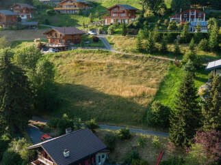 Nestled in a serene hillside, this property showcases stunning chalet-style homes.
