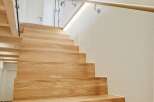 This stunning property features a beautifully crafted wooden staircase, adding warmth and elegance to the interior.
