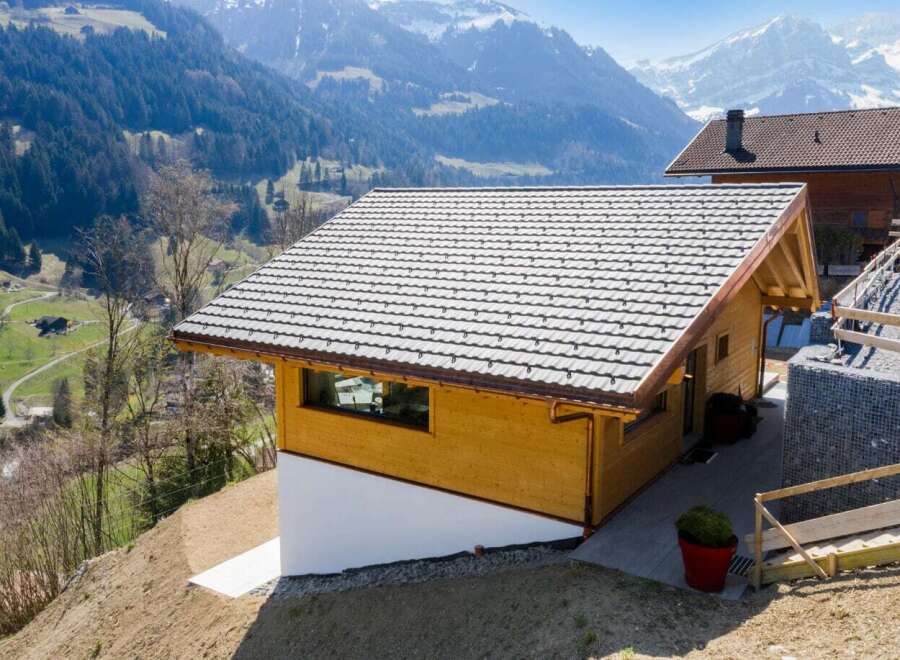 Nestled in a picturesque mountain setting, this charming wooden cabin offers a serene escape.