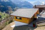 Nestled in a picturesque mountain setting, this charming wooden cabin offers a serene escape.