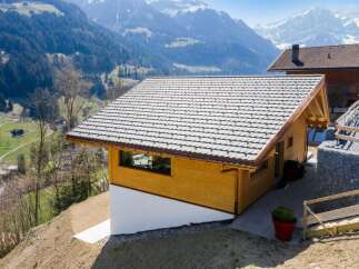 Nestled in a picturesque mountain setting, this charming wooden cabin offers a serene escape.