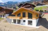 This stunning wooden chalet offers a modern design with a touch of rustic charm.