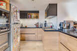 This modern kitchen boasts sleek design and functionality.