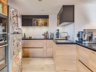 This modern kitchen boasts sleek design and functionality.