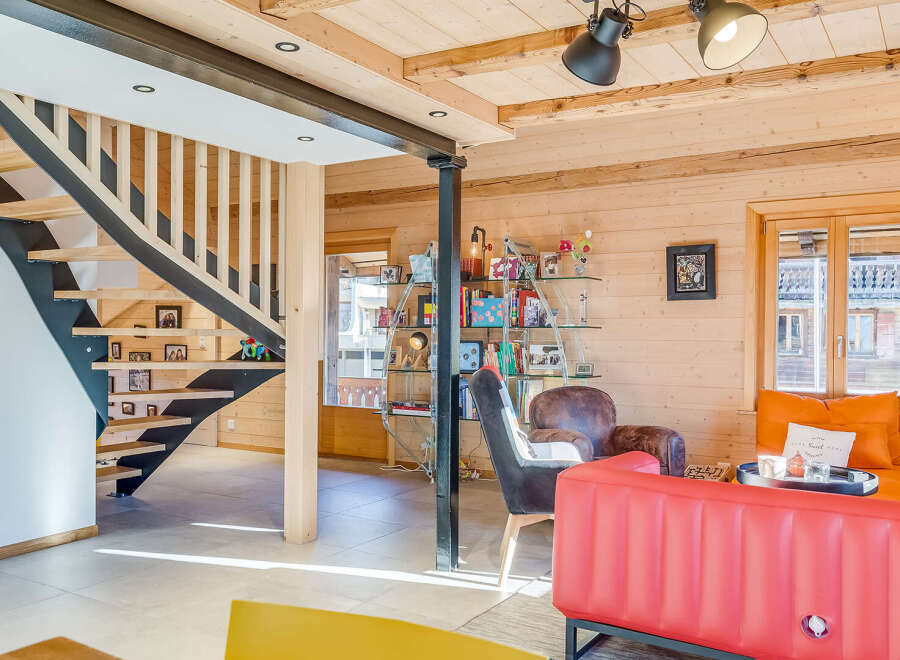 This stunning property boasts a modern interior with a unique wooden design, creating a warm and inviting atmosphere.