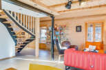 This stunning property boasts a modern interior with a unique wooden design, creating a warm and inviting atmosphere.