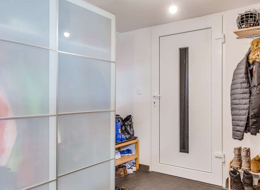 Step into a stylish entryway with ample storage solutions.