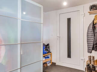 Step into a stylish entryway with ample storage solutions.