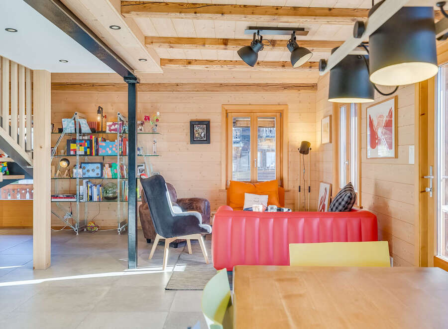 Experience the charm of this cozy chalet, featuring a bright and airy living space with wooden accents and modern furnishings.
