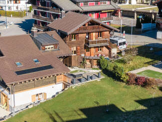 Discover the charm of this stunning property, featuring a beautifully designed wooden exterior and a well-maintained roof.