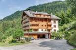 Discover the charm of this exquisite wooden chalet nestled in a picturesque mountain setting.