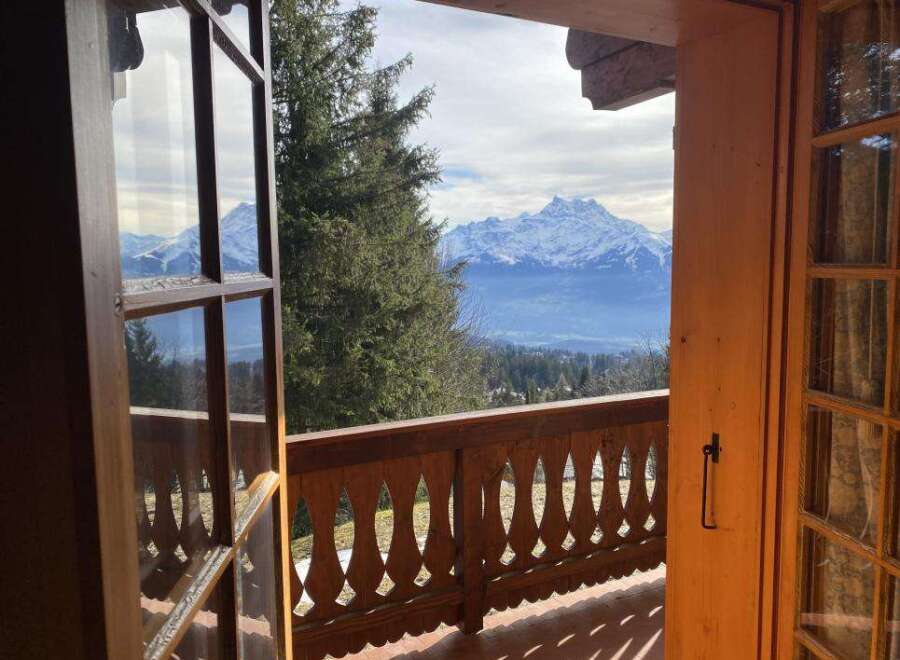 Experience breathtaking mountain views from this charming property.
