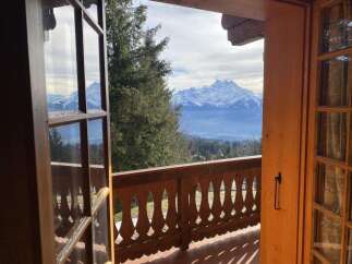 Experience breathtaking mountain views from this charming property.