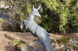 Discover the charm of this unique property, featuring a captivating sculpture of a leaping deer.